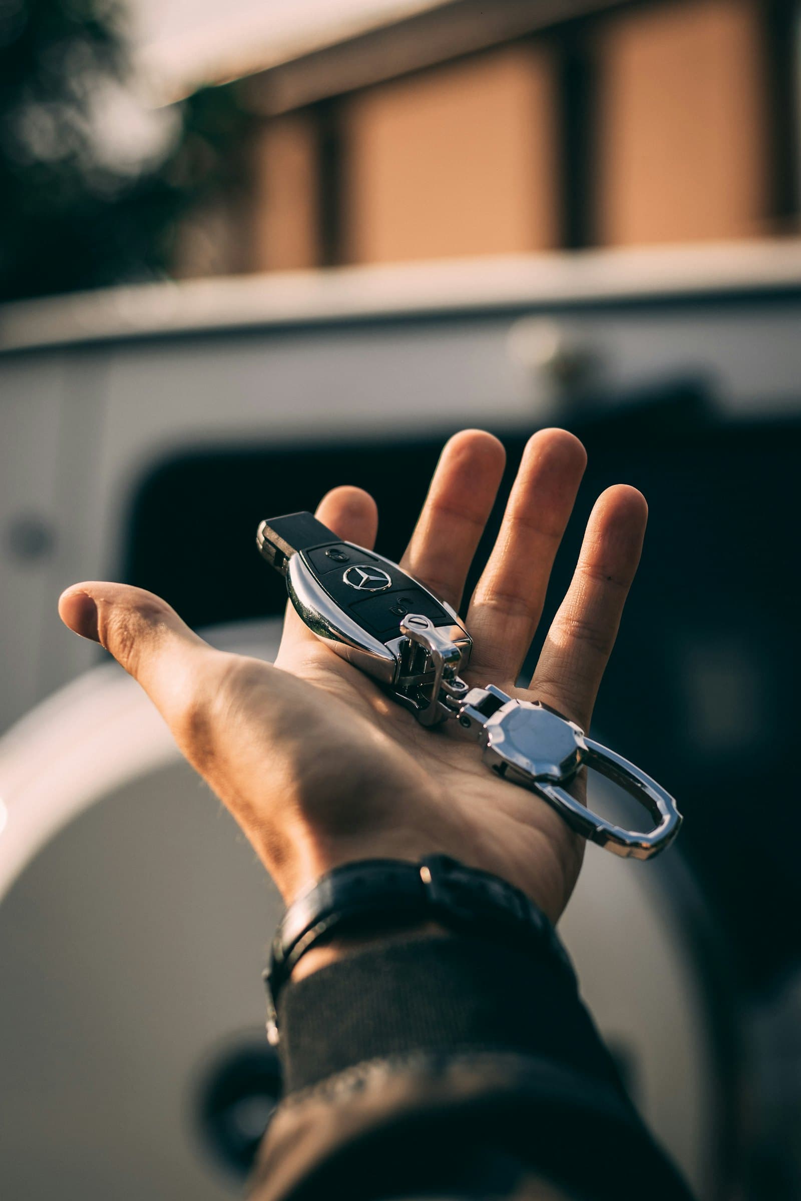 Hand holding a car key fob