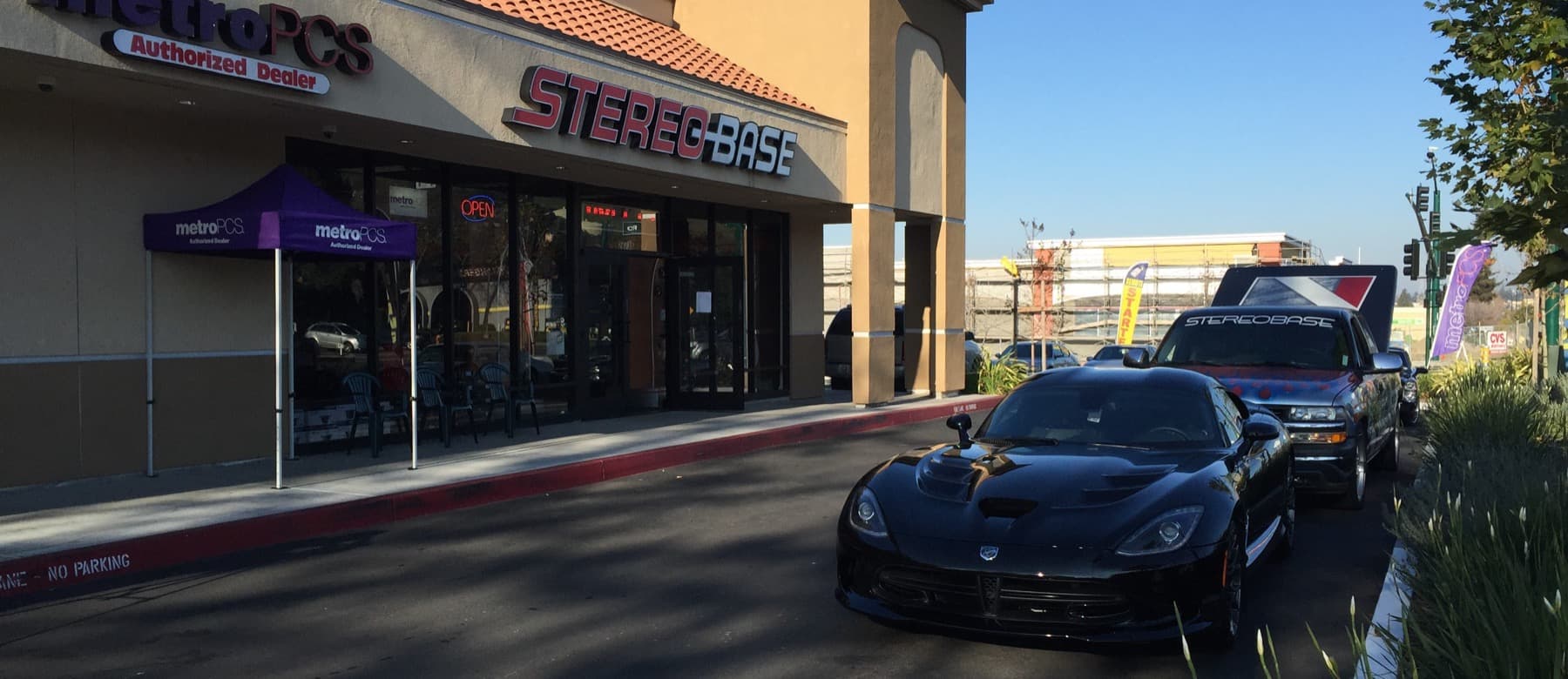 The Stereo Base storefront seen through a car’s side window